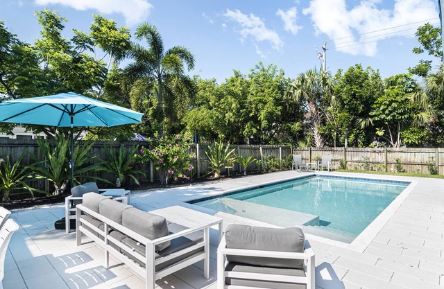 Centrally located 4 bedroom 3 bathrooms home with new pool!