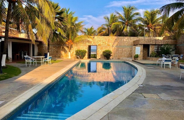 Charming 3-bedroom beach front house with WiFi and AC in Tucacas
