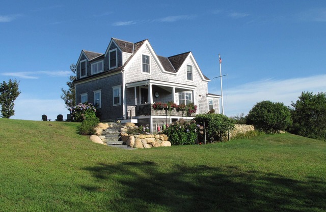 Charming 3BR Cottage Perched above the Sea Offers Spectacular Ocean Sunsets