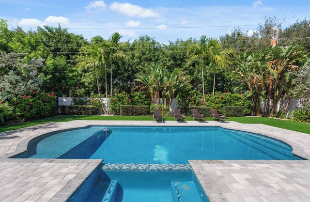 Charming 4-Bedroom Beach Bungalow with Idyllic Pool & Backyard