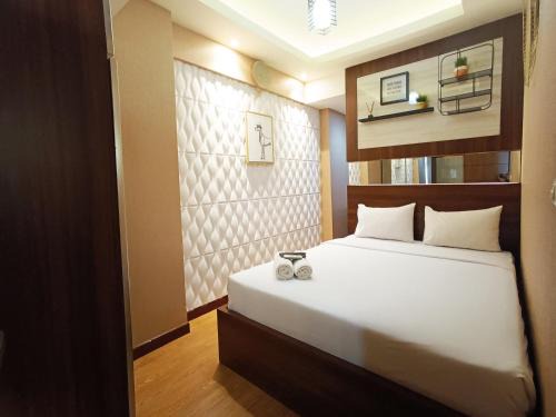 Comfort and Strategic 2BR Apartment at Vida View Makassar By Travelio