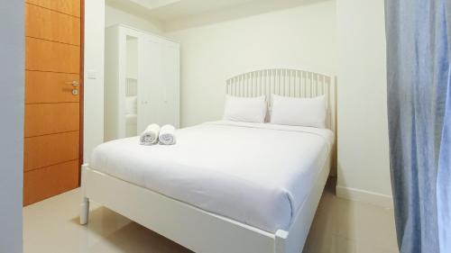 Comfortable and Tidy 2BR at Vida View Apartment By Travelio