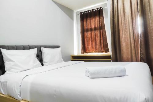 Comfy and Minimalist Studio at Vida View Apartment By Travelio