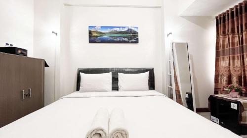 Compact Studio Room Apartment Vida View Makassar By Travelio