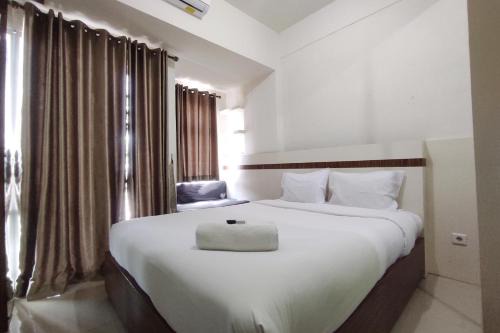 Convenient Studio Apartment at Vida View Makassar By Travelio