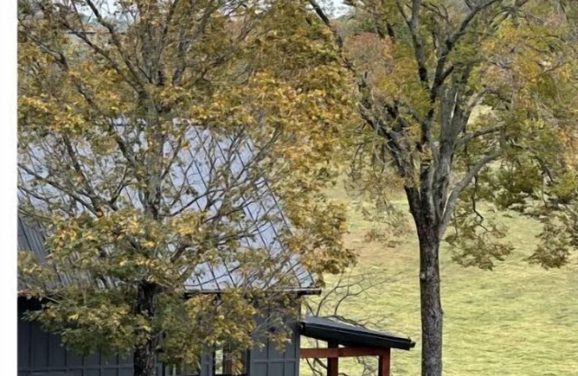 Cottage offering Luxury & Privacy on 80 acres with stocked pond.