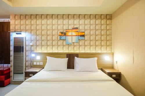 Cozy 1BR Apartment with Workspace at Mustika Golf Residence By Travelio