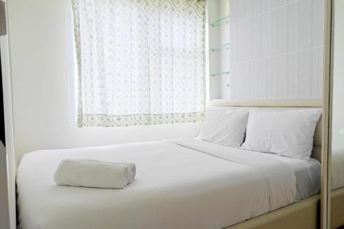 Cozy Stay and Homey 2BR Vida View Apartment By Travelio