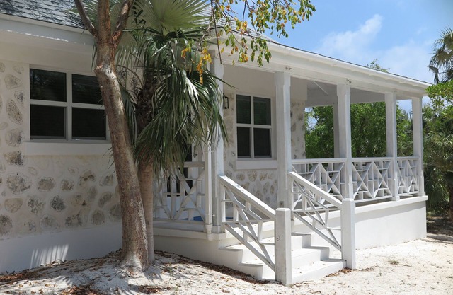 Cozy stone studio cottage on private pink sand beach