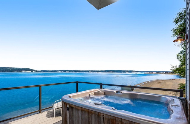 Custom, oceanfront home with private hot tub, beach access, & stunning views