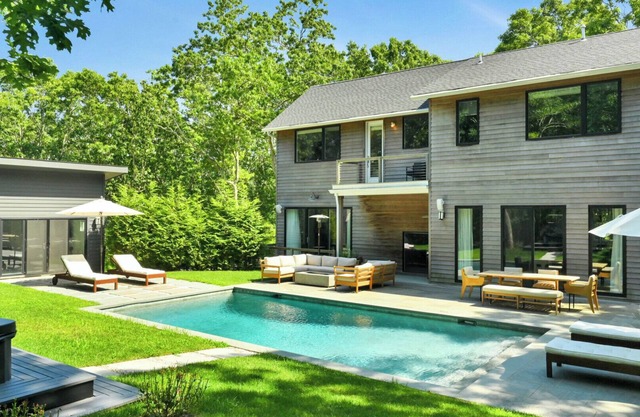 Designer Gut Renovated Farmhouse on over 1 Acre, Numerous Spacious Living.