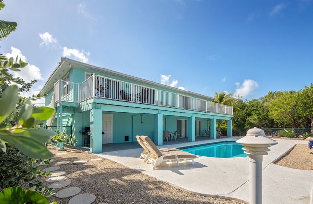 Dog-friendly, canal-front home with seawall dock, heated pool & gas grills