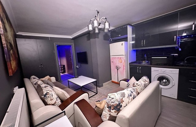 Elegant 1-Bedroom Apartment with Private Yard, Steps from Taksim Square