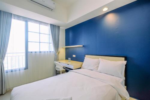 Elegant Studio at Evenciio Margonda Apartment By Travelio