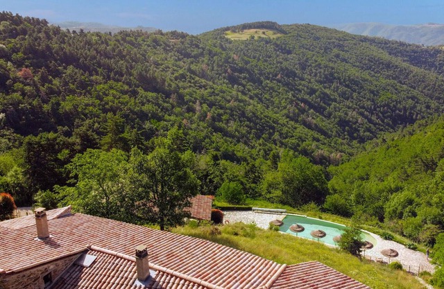 Enjoy a magnificent mountain panorama in this luxury vacation home with pool and sauna.