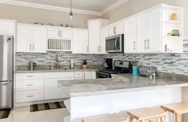 Escape to Ocho Rios in this bright & airy coastal home. Central to attractions.