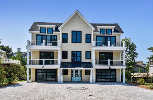Exceptional beach home located just steps from the beach front in beautiful family friendly Ocean Village, one of North Bethanyâ€™s most sought after private gated communities!