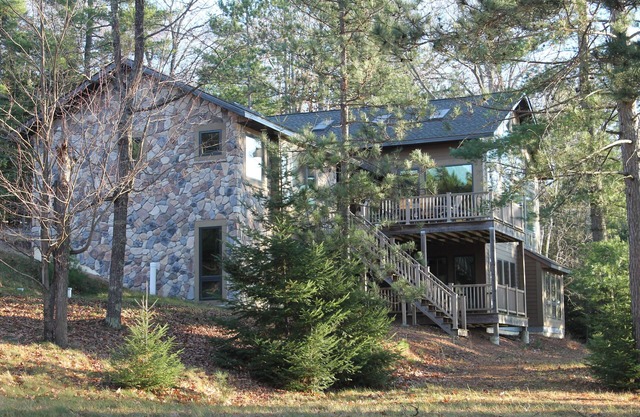 Experience serenity relaxing in this single family home on the Manitowish Chain