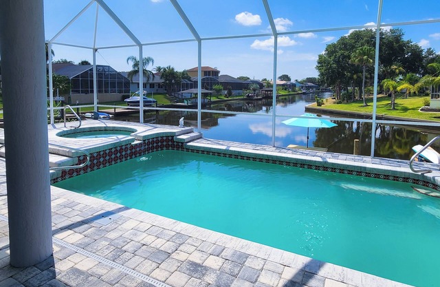 Five Star 3bd Waterfront Canal Home w/Private Pool/Spa & Boat Dock.