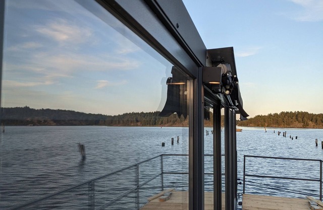 Floating house, unobstructed view of the beautiful water with boat, Blankaholm Sweden
