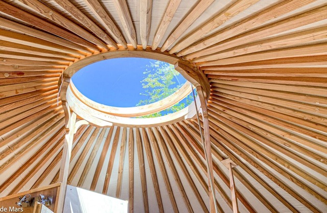 Fully equipped "Kilimanjaro" ethnic yurt near a large lake.