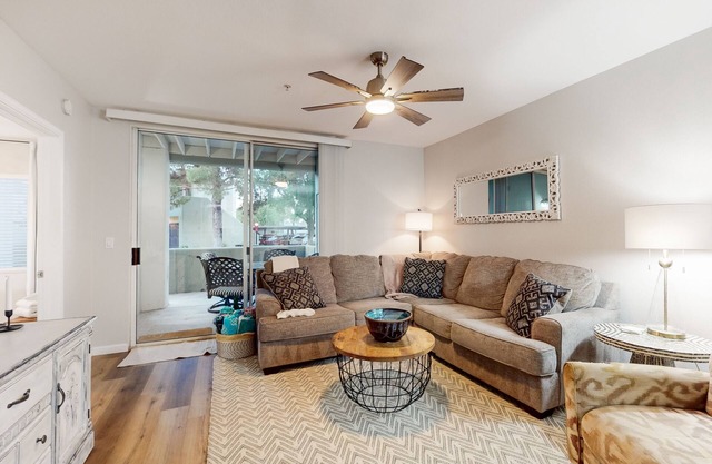 Ground-floor condo with on-site pool, pickleball, hot tub, gym & private balcony