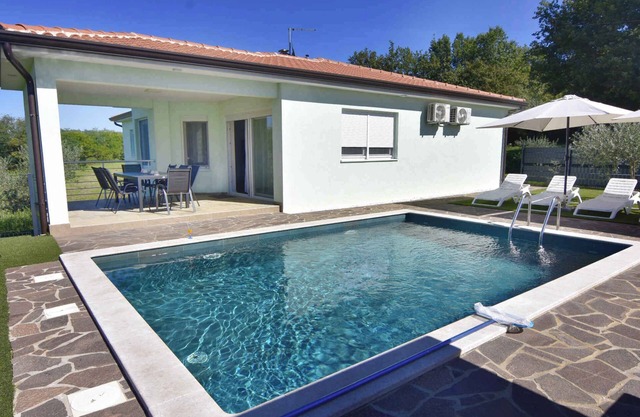 Holiday home with outdoor swimming pool
