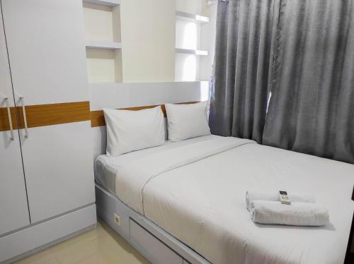 Homey and Comfy 2BR at Vida View Apartment By Travelio