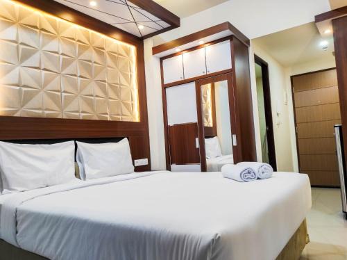 Homey and Comfy Studio at Vida View Makasar Apartment By Travelio