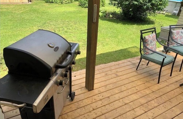 House across from lake in quiet neighbourhood with a nice size yard and firepit