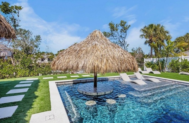 Huge Fall Discounts! New Breathtaking Canal front Home on Best street in AMI!