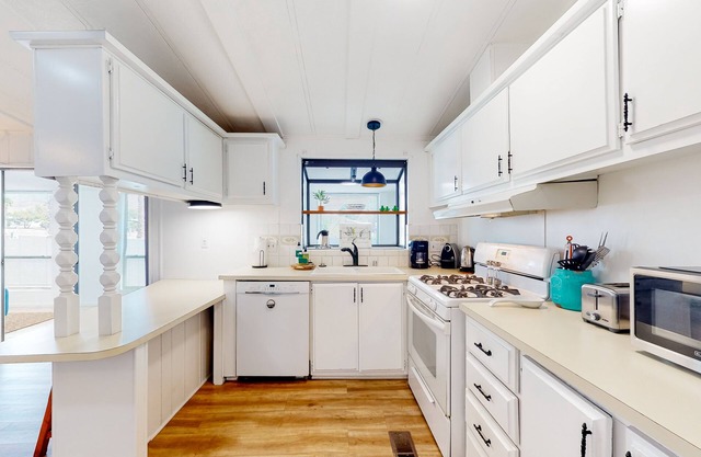 Inviting dog-friendly home with pool, tennis, grill, patio, central AC, & W/D