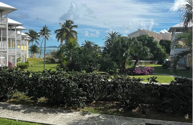 Island Carribean Getaway! 1 King bed! 2BR/2BA Condo with beach access and pool!