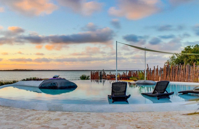 Lagoon-front studio with water access, infinity pool, & AC