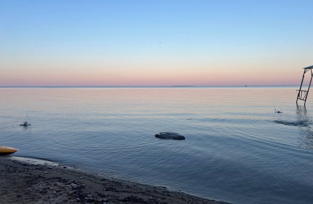Lake Huron view just a minute walk to private sandy beach.