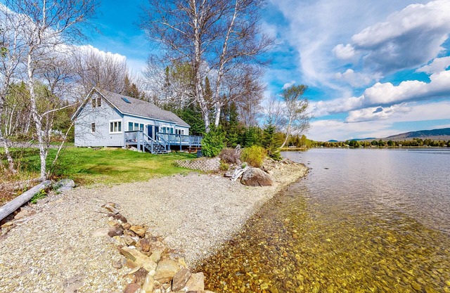 Lakefront home with private dock, mooring, pebble beach, grill, & firepit