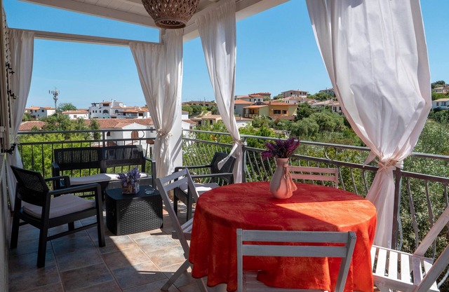 Large covered veranda 1 km from the beach Budoni Rentals