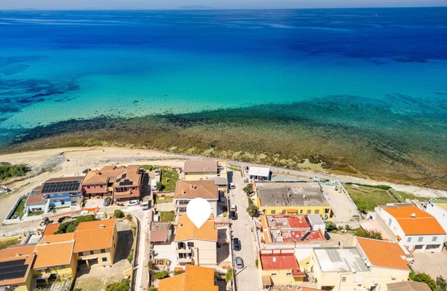 Large seaside apartment with patio in Lu Bagnu