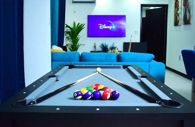 Luxury Condo in New Kingston. Centrally located, pool table, movie theater!