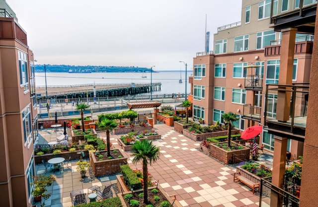 Luxury waterfront unit in downtown Seattle with balcony, A/C, and parking