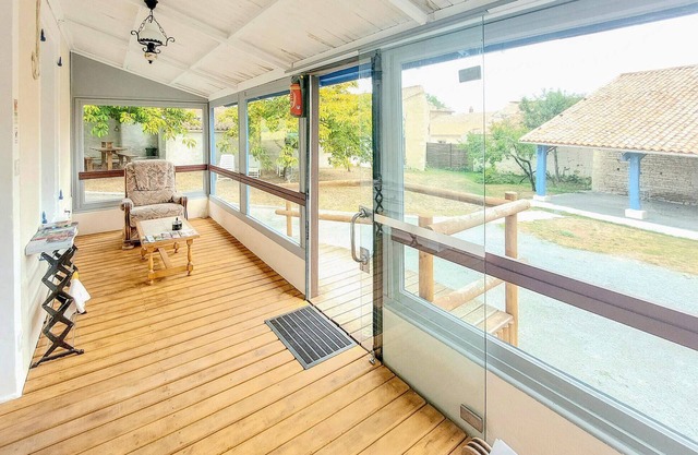 Modern cottage with glazed veranda and play area for the whole family.