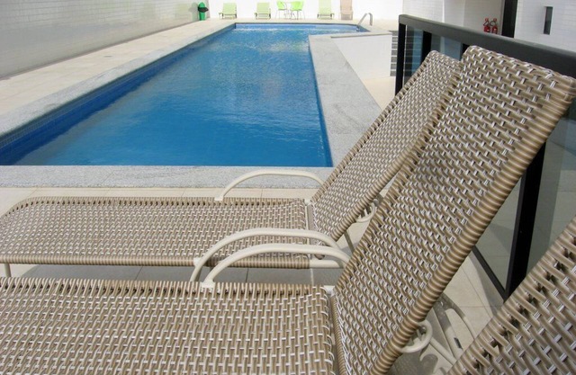 Modern fully-furnished apartment with swimming pool, gym and game room.