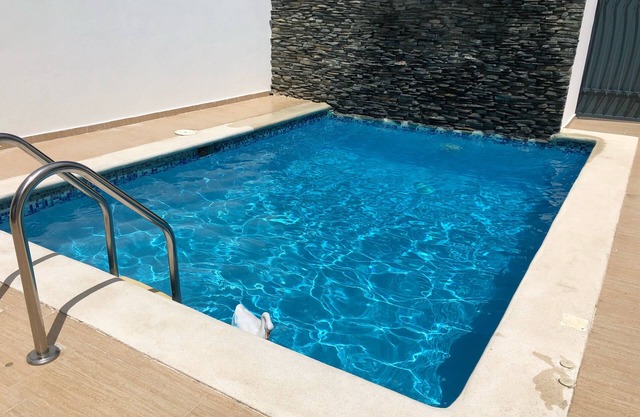Modern pool house with 24 security gated