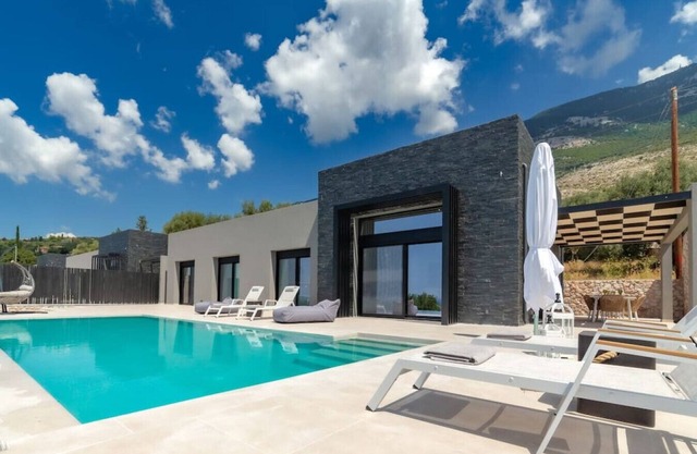 Modern villa in Lourdas with infinity pool and panoramic sea views