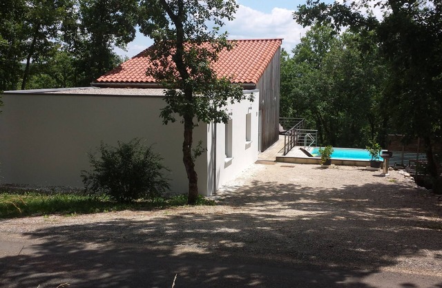 Modern wooden house with tree terrace and private heated pool