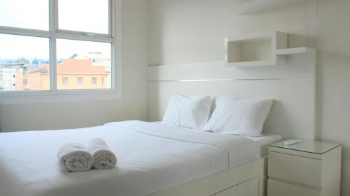Modest 1BR Apartment at Parahyangan Residence By Travelio