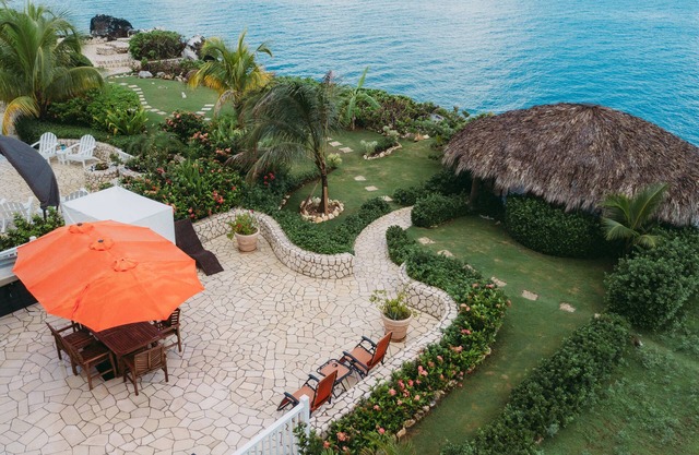 Negril Bungalow Paradise overlooking cliffs with Private Snorkeling Entrance.