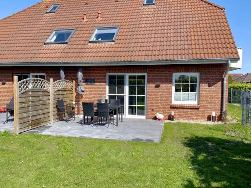 Nessmersiel, Renovierte Erdgeschosswohnung mit Garten in Deichnähe, Wallbox, Bettwäsche inklusive