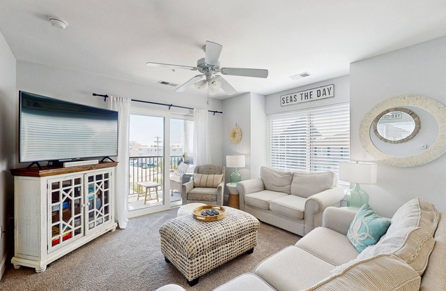Ocean-view condo near the beach with pool, balcony, central AC & washer/dryer