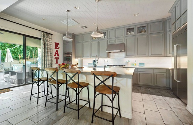 Olive Treeside, a luxury oasis with a pool, pizza oven, grill, fireplace